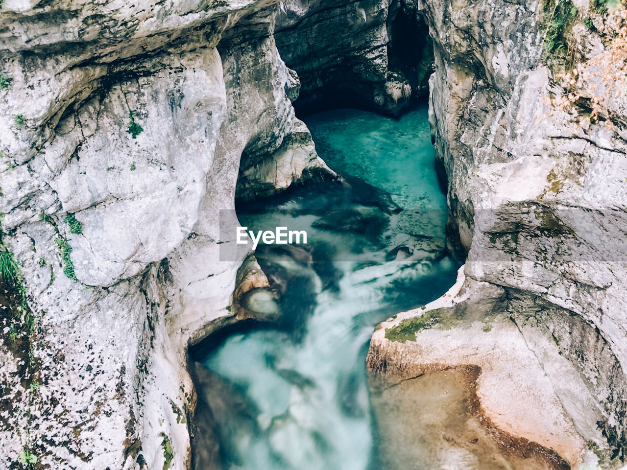 High angle view of water flowing through rocks