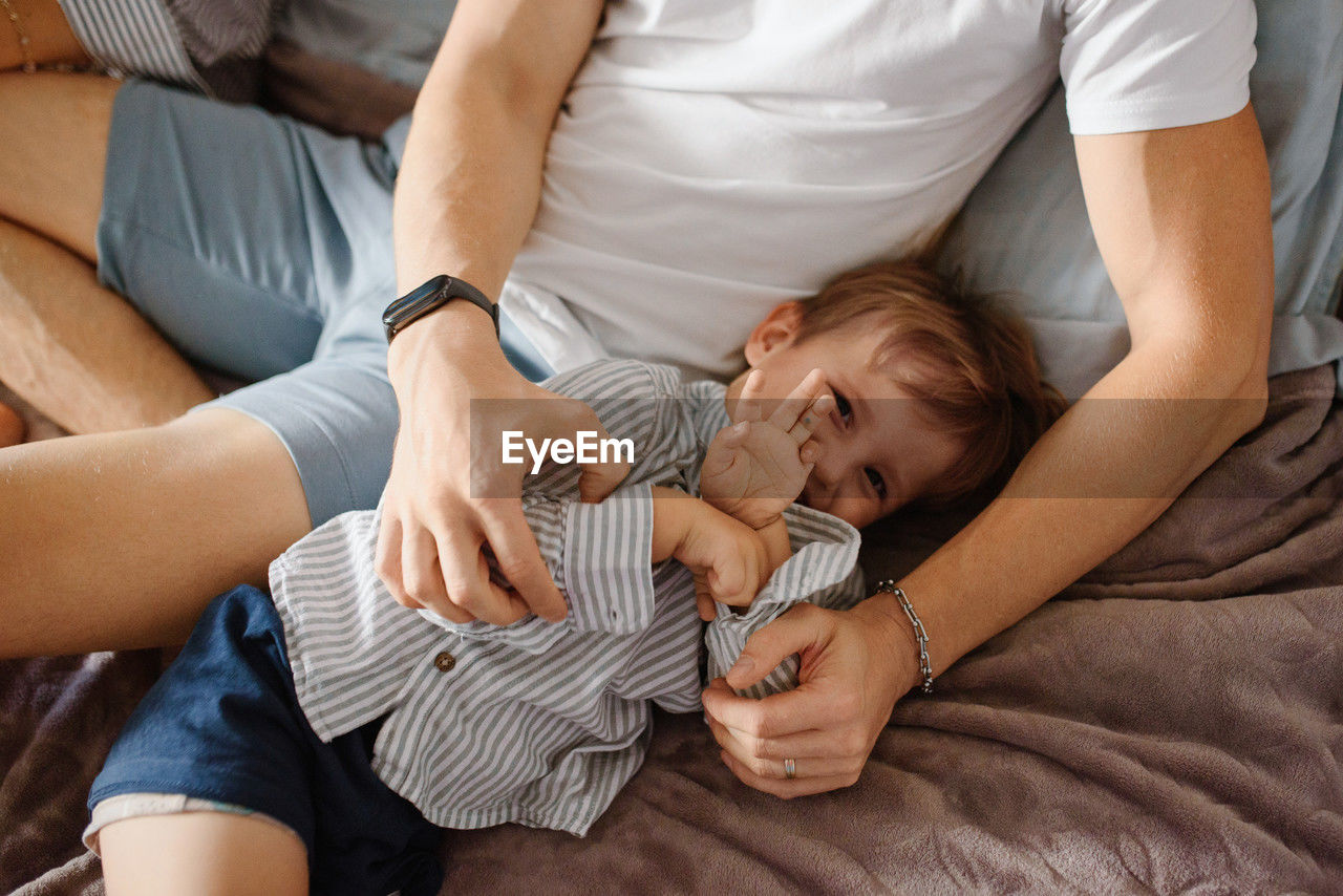 midsection of woman with dogs