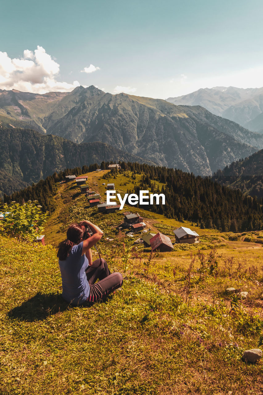 A tourist taking a photo on the pokut plateau, which borders rize province in the black sea 