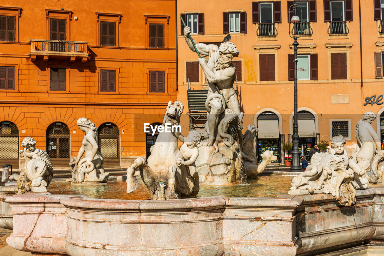 Statue in front of historical building