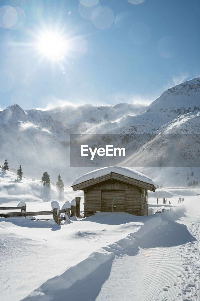 Wooden hut in winter wonderland in sportgastein ski resort, gastein, salzburg, austria