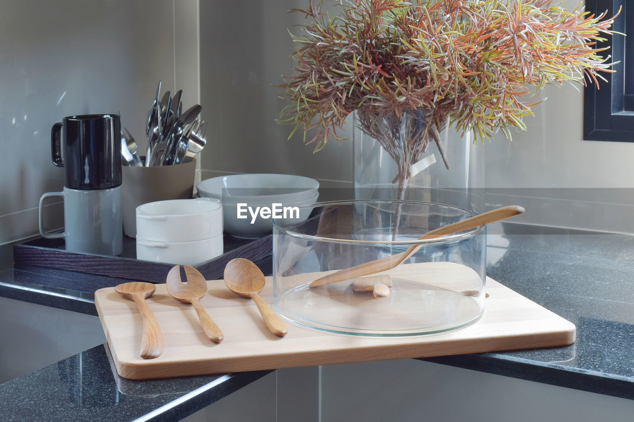 TABLE AND POTTED PLANTS ON SHELF AT HOME