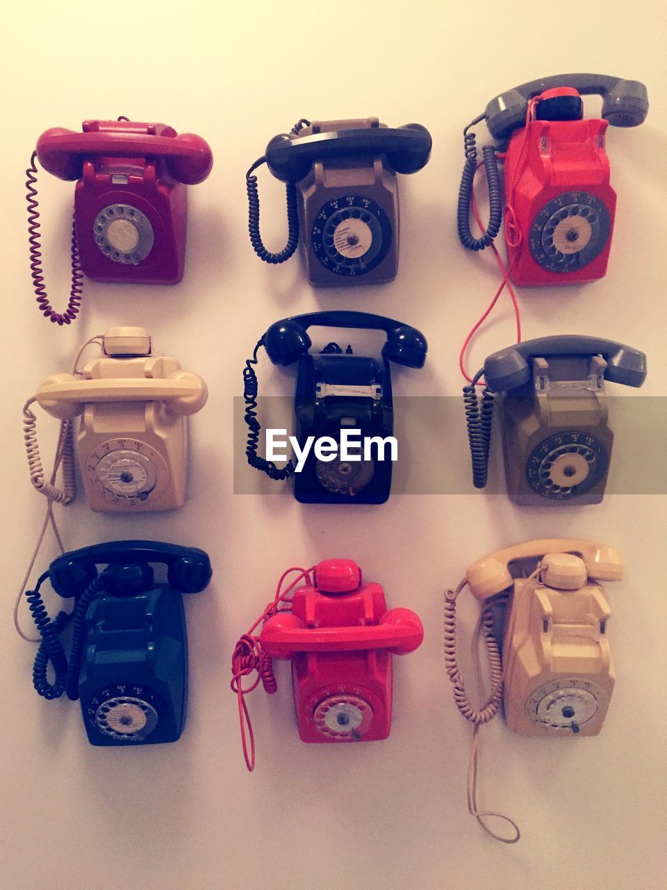 High angle view of old landline telephones on floor