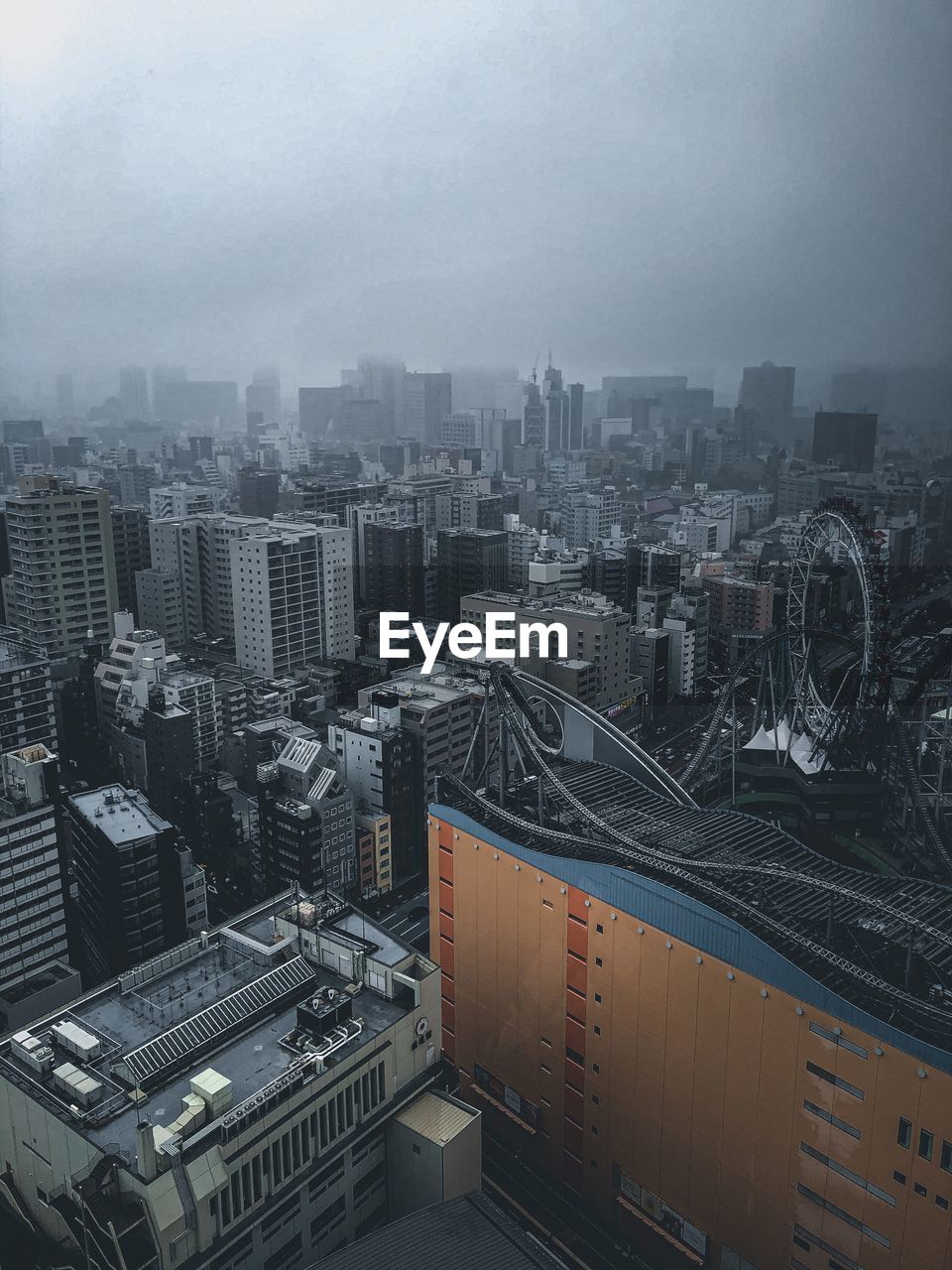 HIGH ANGLE VIEW OF MODERN BUILDINGS AGAINST SKY IN CITY