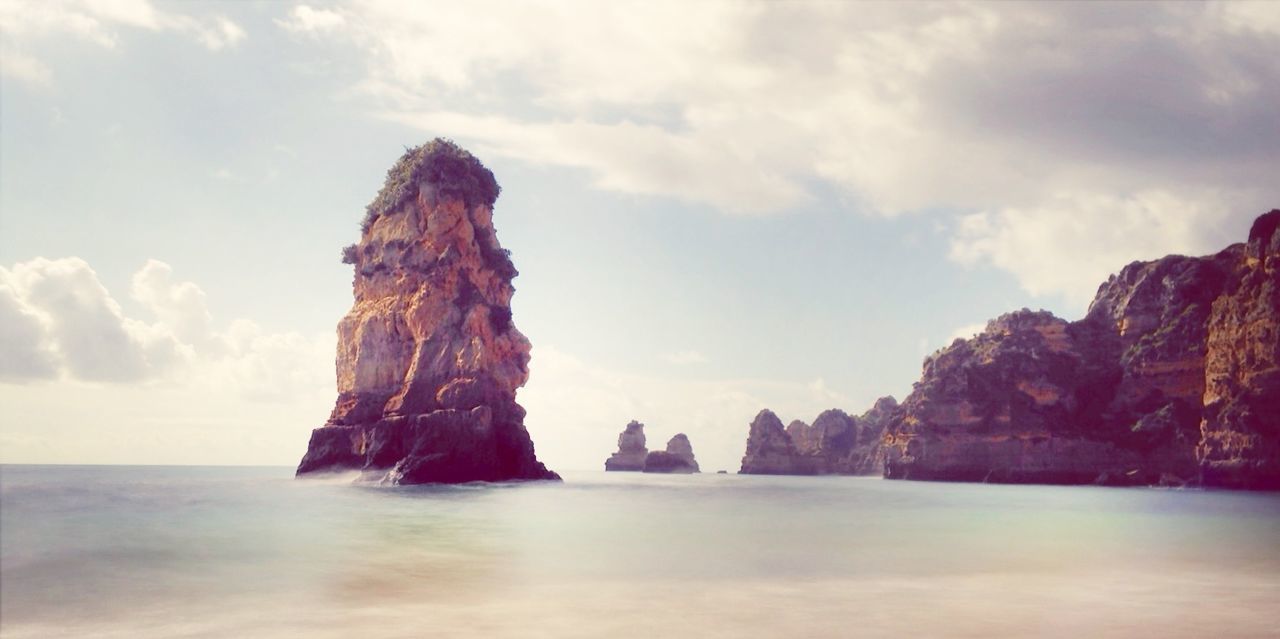 Scenic view of stack rock in sea