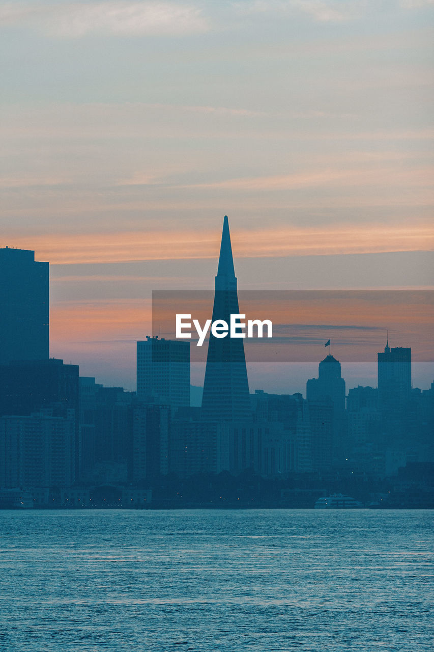 BUILDINGS AGAINST SKY DURING SUNSET