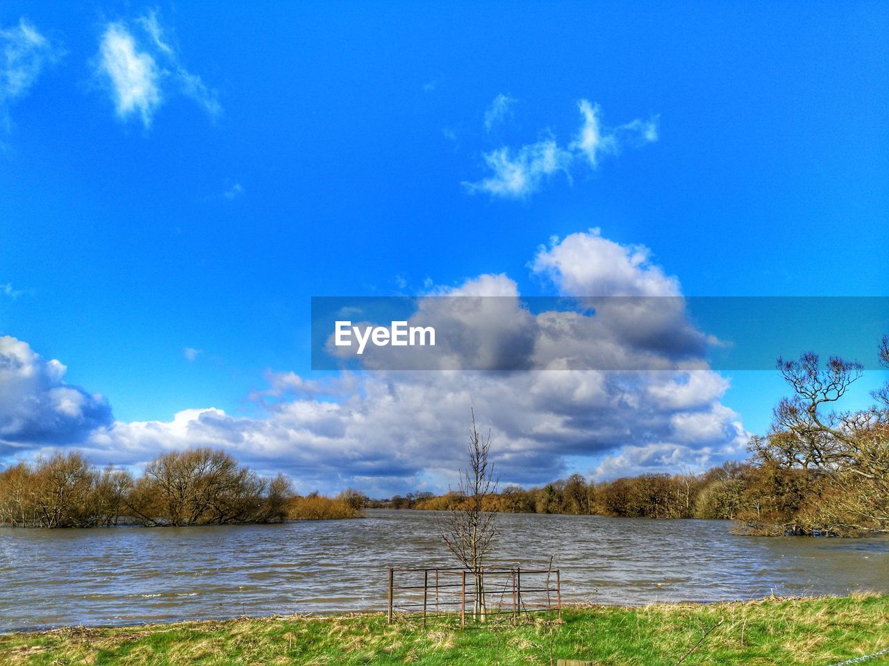 VIEW OF LAKE AGAINST BLUE SKY