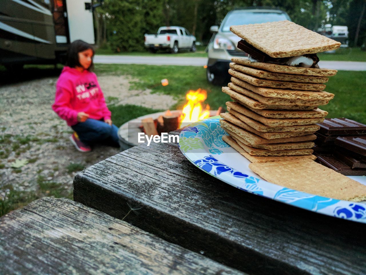 Close-up of crackers in plate on table at backyard