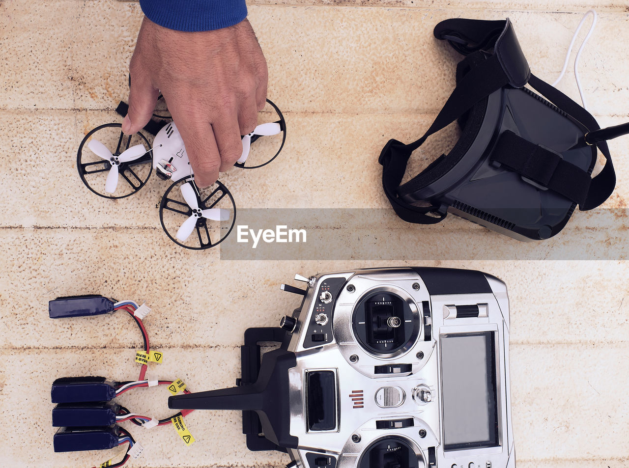 Young man prepares the drone for flight