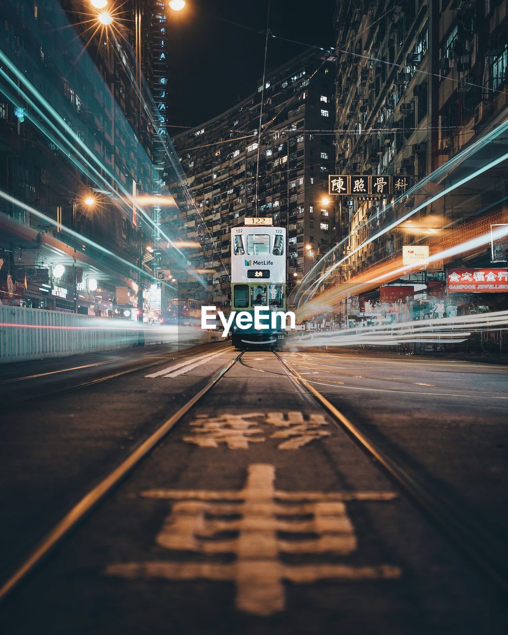 View of train amidst light trails at night