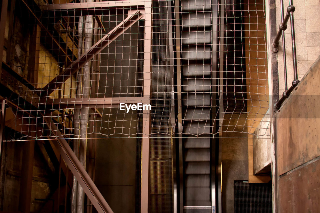 Low angle view of escalator in industry