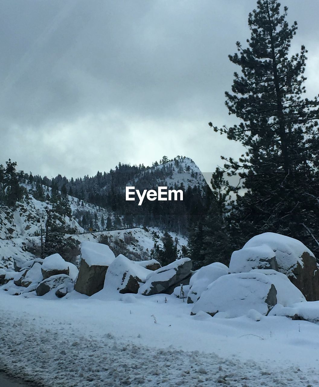 Scenic view of landscape against sky during winter