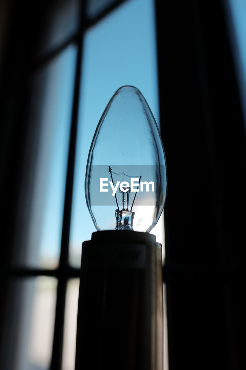 Close-up of light bulb at home
