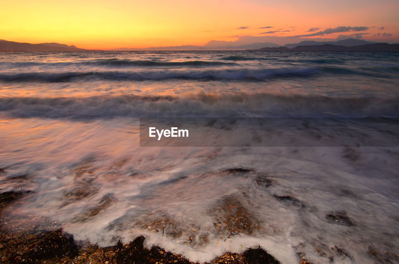 Scenic view of sea against sky during sunset