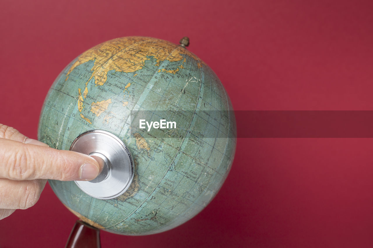 World globe with stethoscope on red background to mean an environment concept