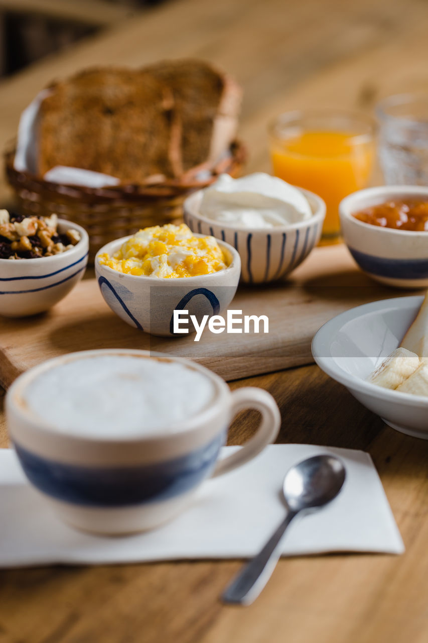 CLOSE-UP OF BREAKFAST SERVED WITH FOOD ON TABLE