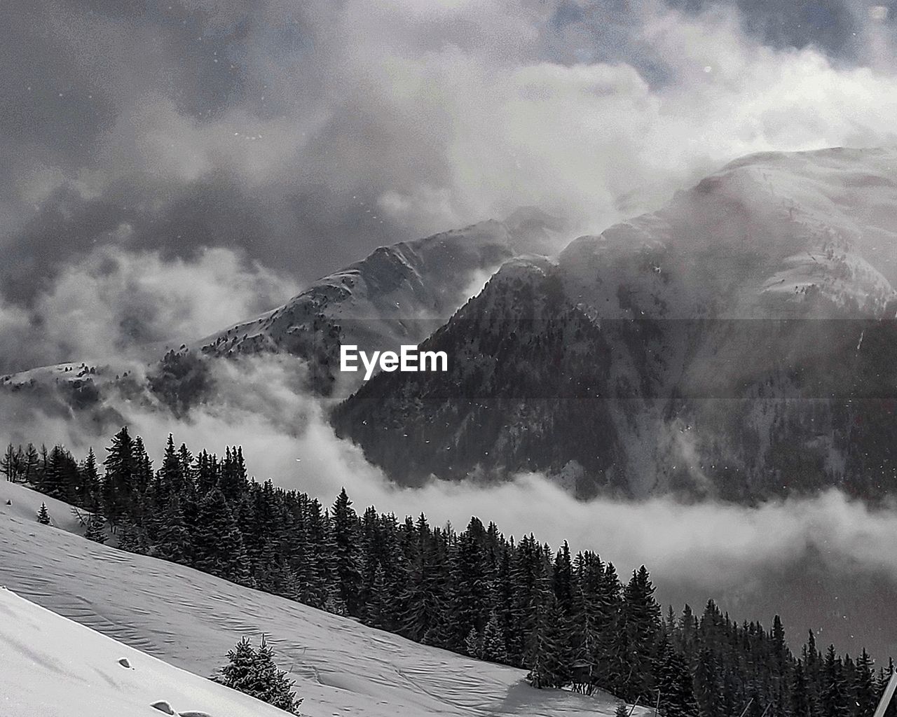 Scenic view of snowcapped mountains against sky