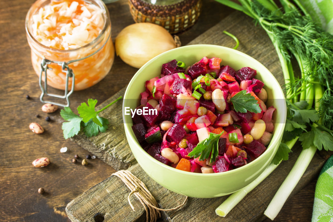 Beetroot salad vinaigrette with sauerkraut, pickled cucumber and vegetables. 