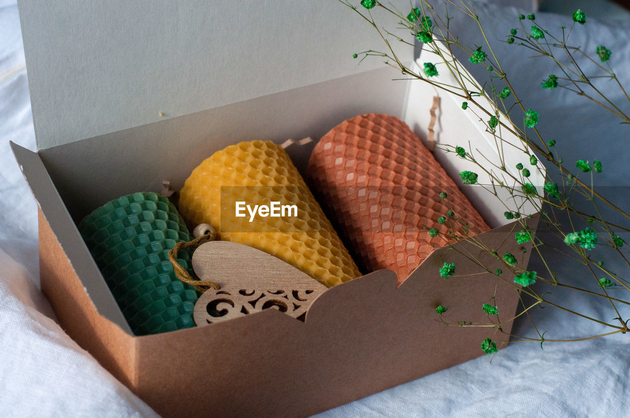 HIGH ANGLE VIEW OF VARIOUS FRUITS IN BOX ON FLOOR