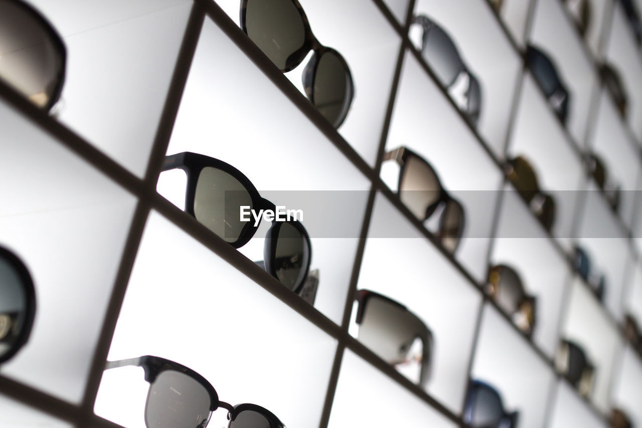 Full frame shot of sunglasses on shelf at store
