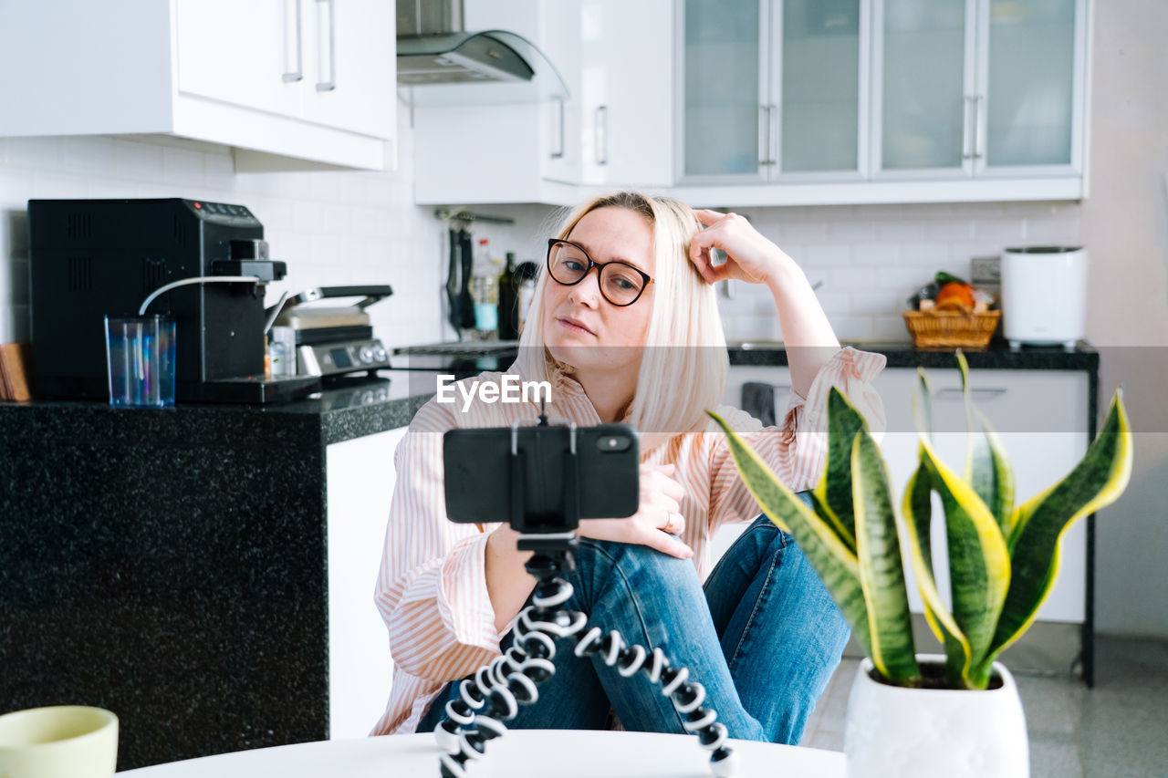 Woman talking on video call at home