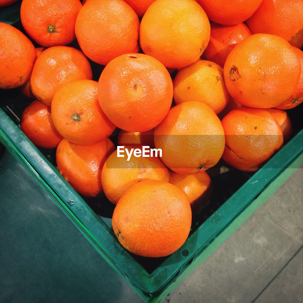 Close-up of oranges in crate