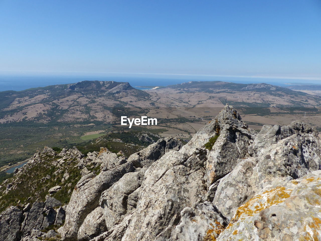 Scenic view of landscape against clear blue sky