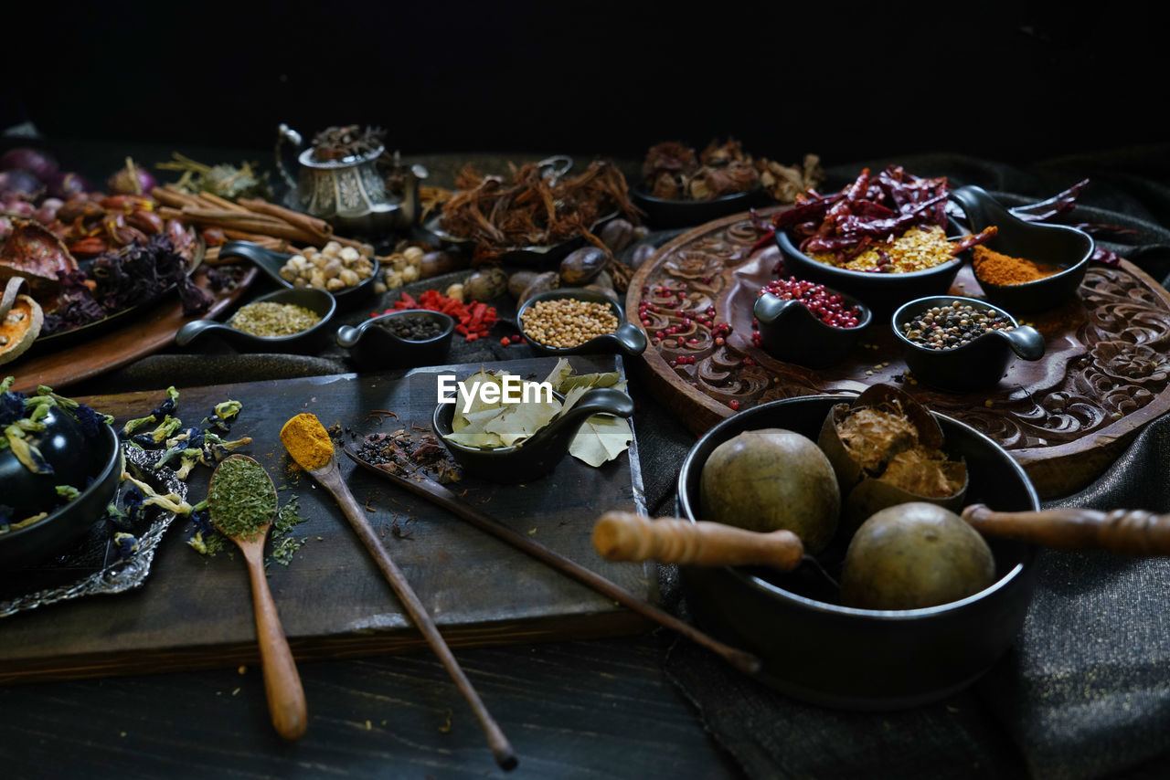 A variety spices and herbs in wooden bowls, of asians for cooking thai seasonings and herbs