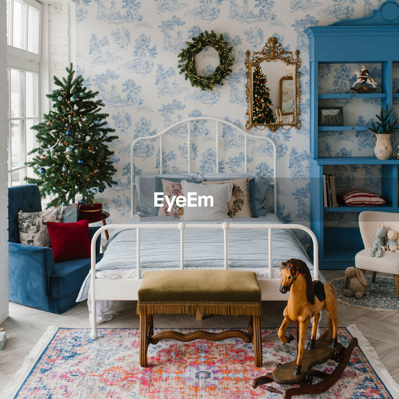 Christmas bedroom interior in blue tones. a cozy home moment on the eve of the holiday