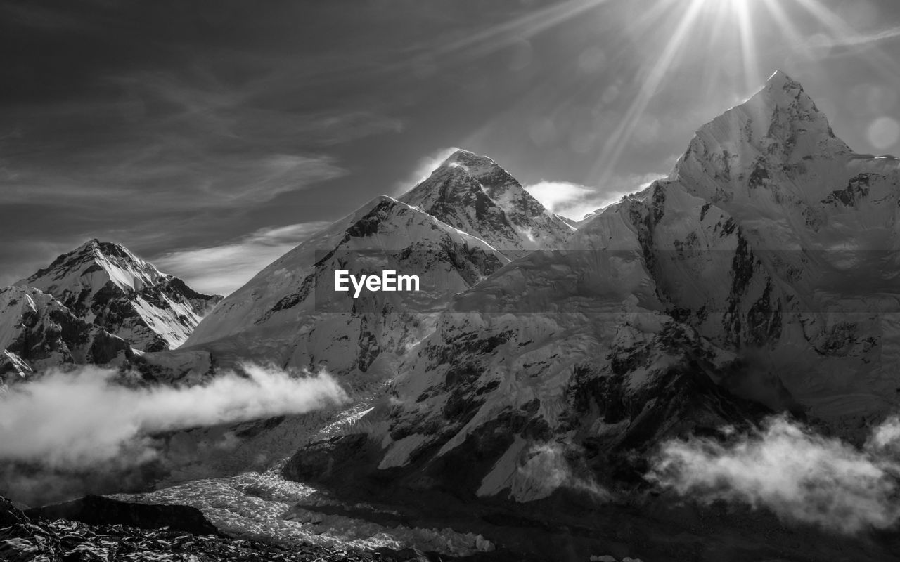 Scenic view of snowcapped mountains against sky