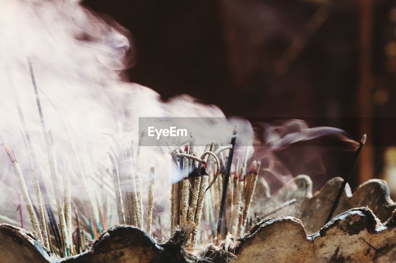 Burning incense sticks at temple