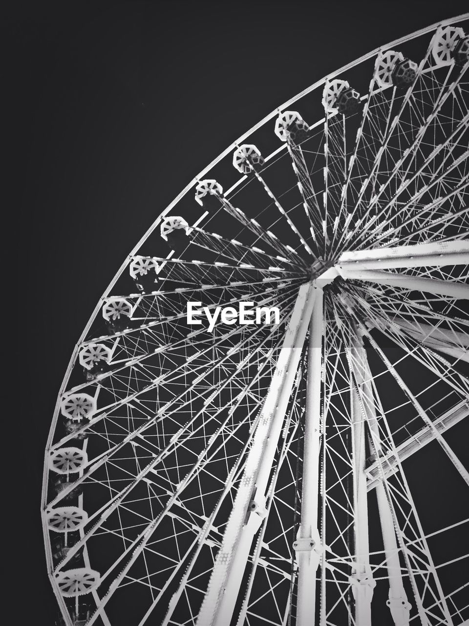 LOW ANGLE VIEW OF ILLUMINATED FERRIS WHEEL