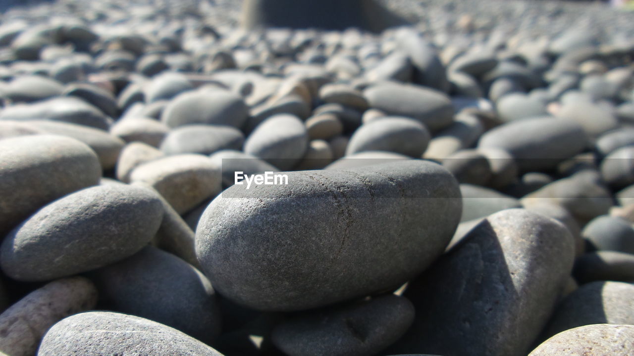 Close-up of pebbles on beach