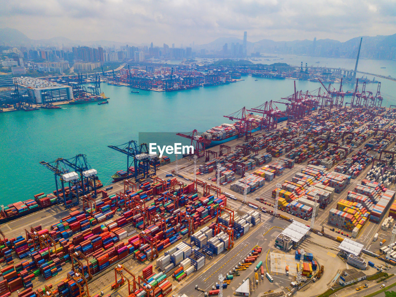 HIGH ANGLE VIEW OF HARBOR AGAINST SKY