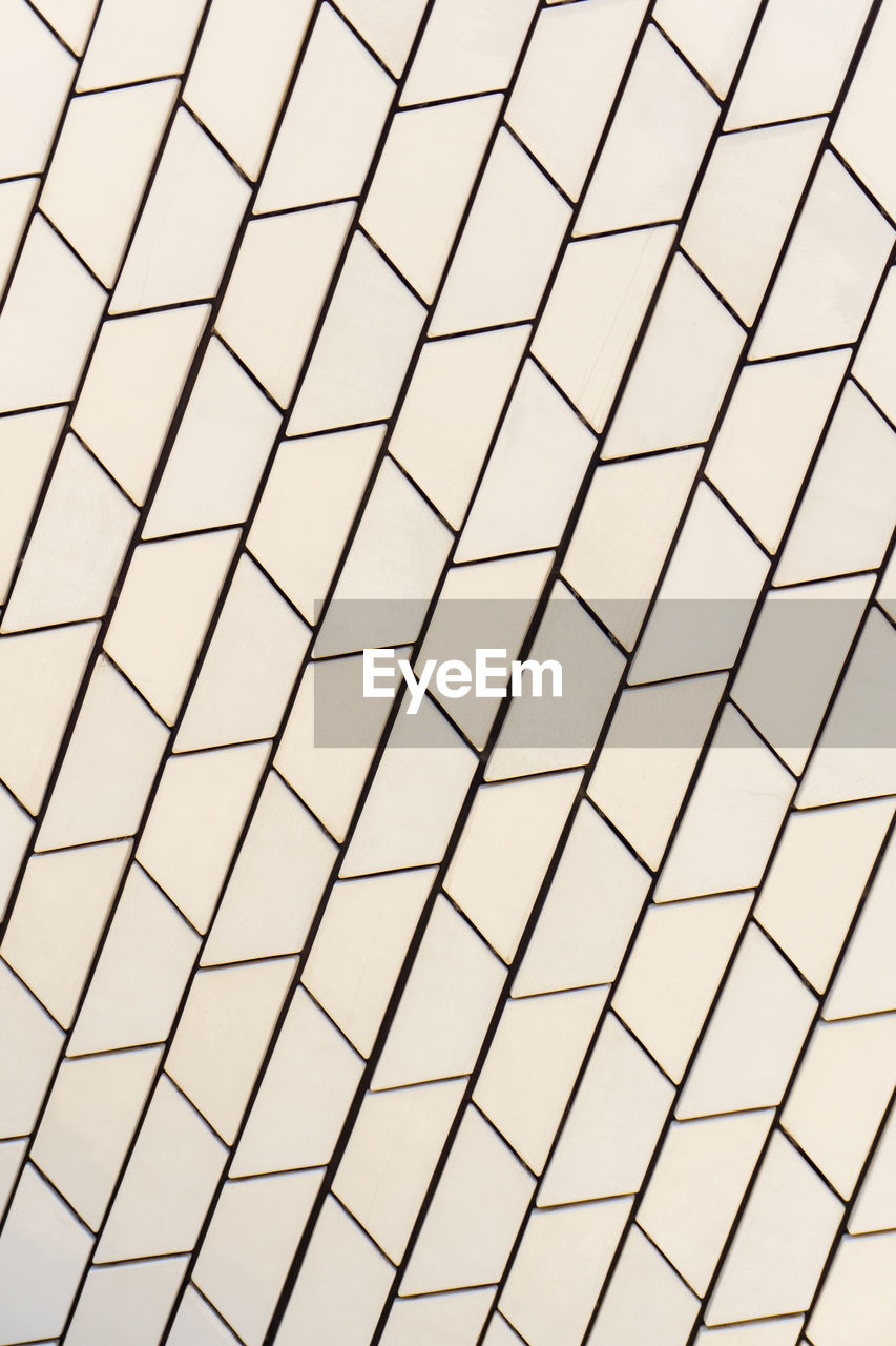 Angled white tile pattern perspective close up background