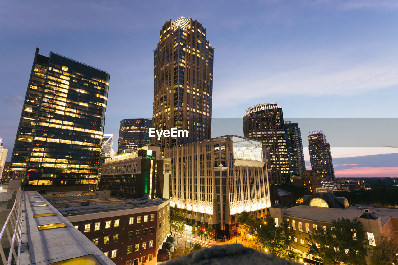 MODERN BUILDINGS IN CITY AGAINST SKY