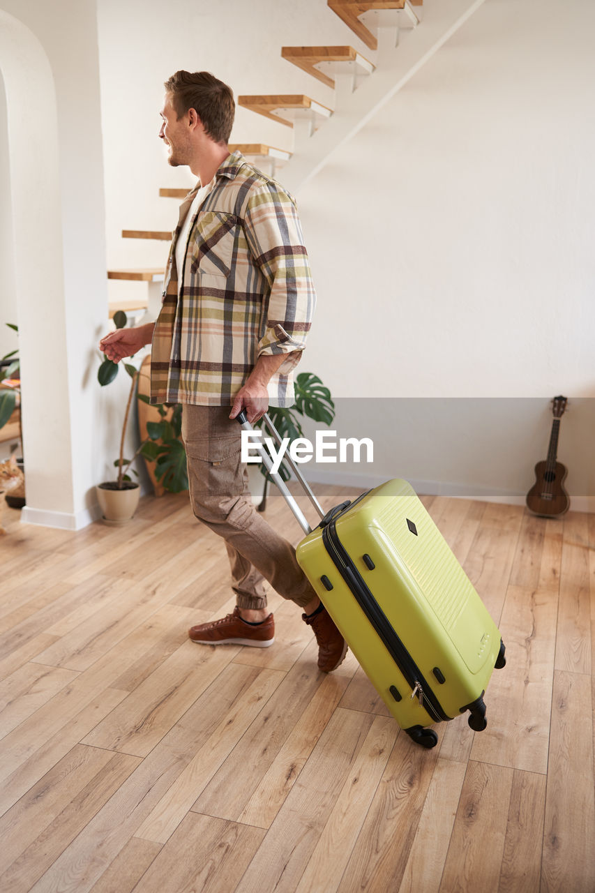 side view of man working at airport