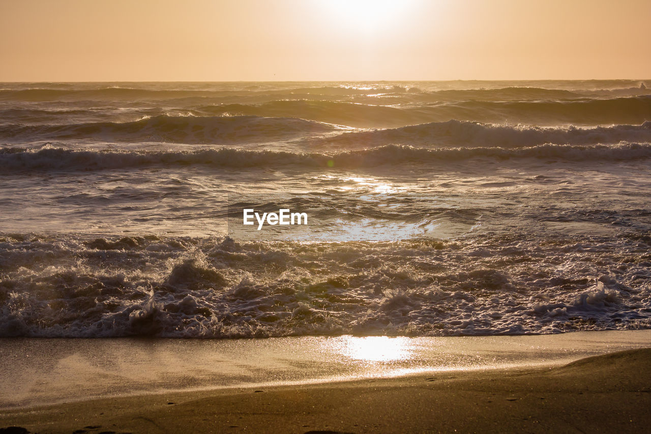 Scenic view of sea against sky during sunset