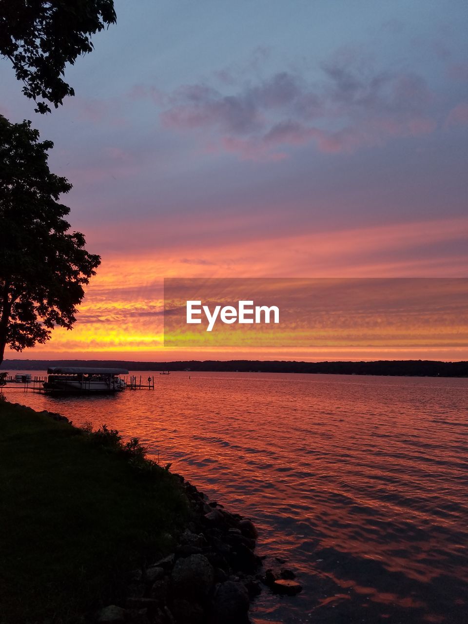 Scenic view of calm sea at sunset