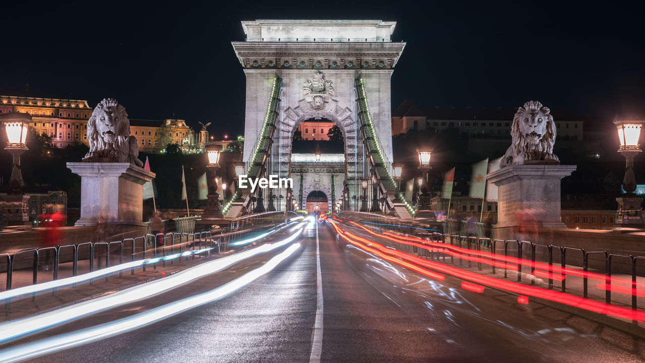 Light trails on road in city at night