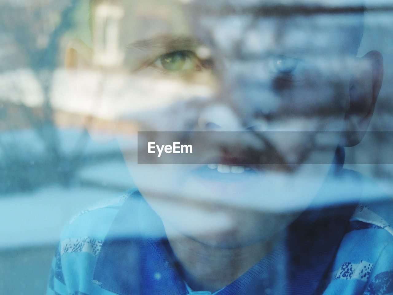 CLOSE-UP PORTRAIT OF A MAN WITH REFLECTION