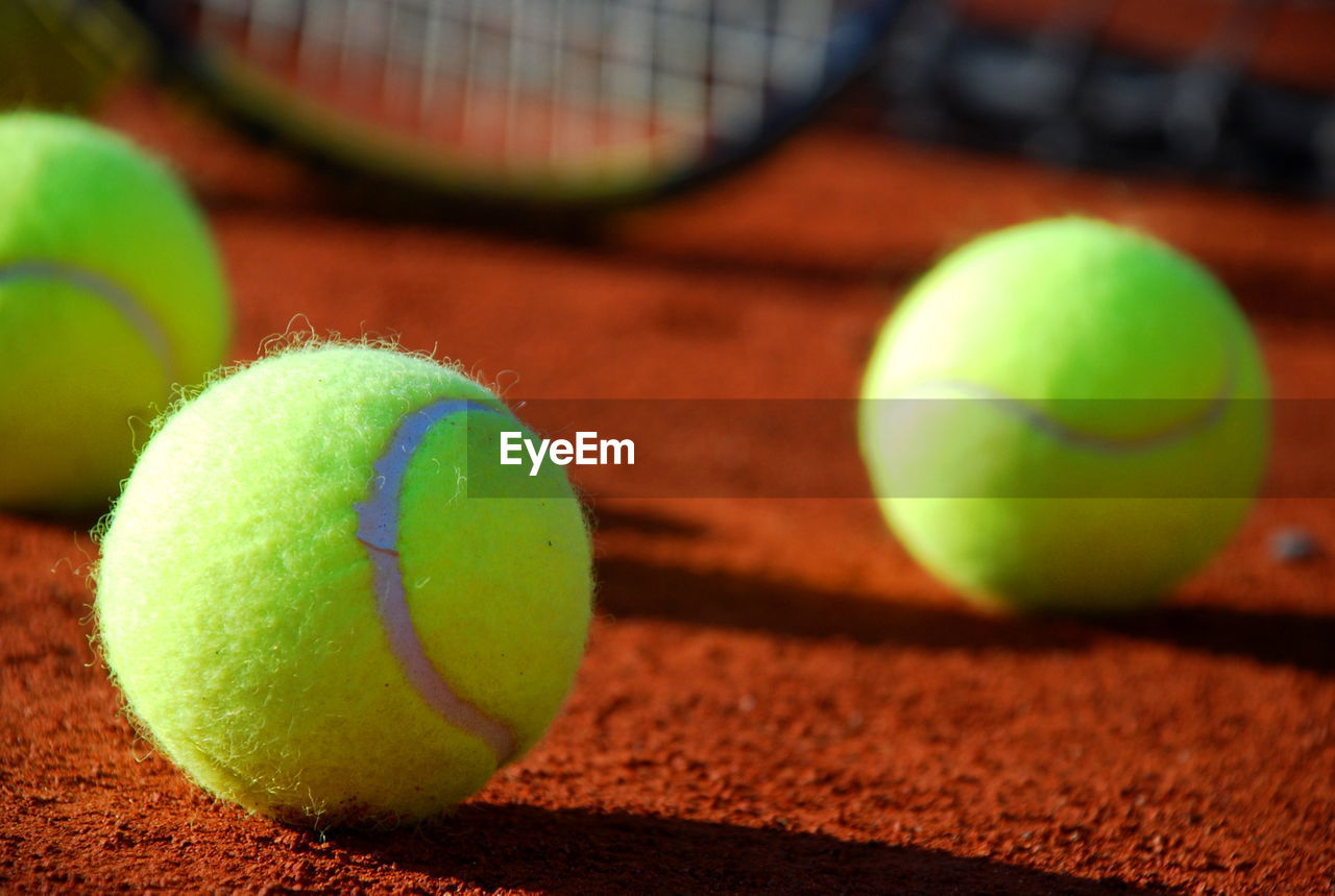 Close-up of tennis balls on field