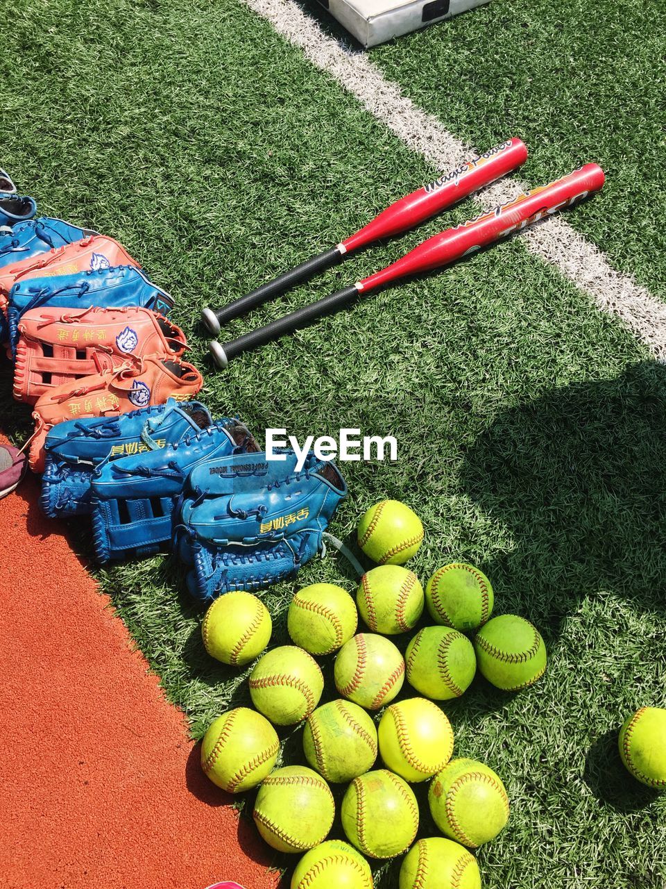 High angle view of baseball equipment at playground