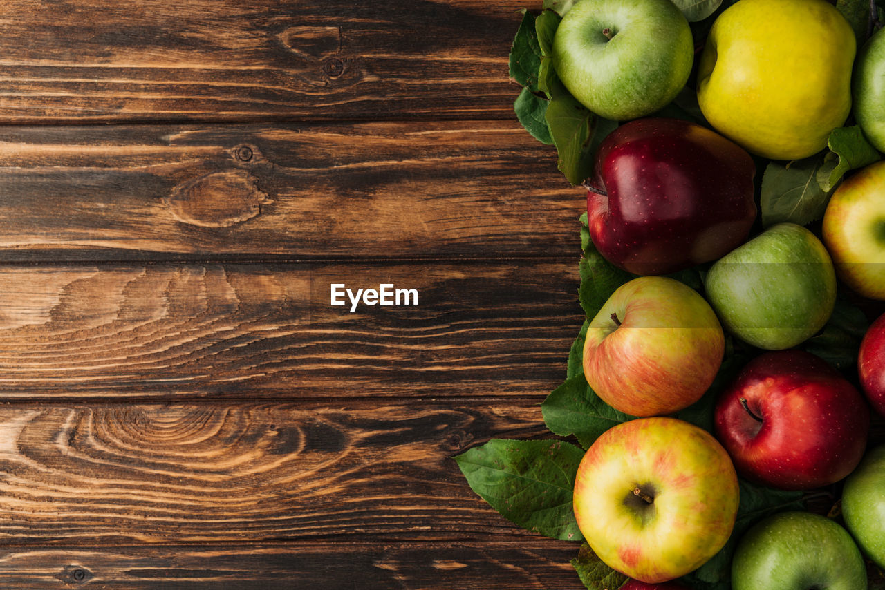 high angle view of apples on wooden table