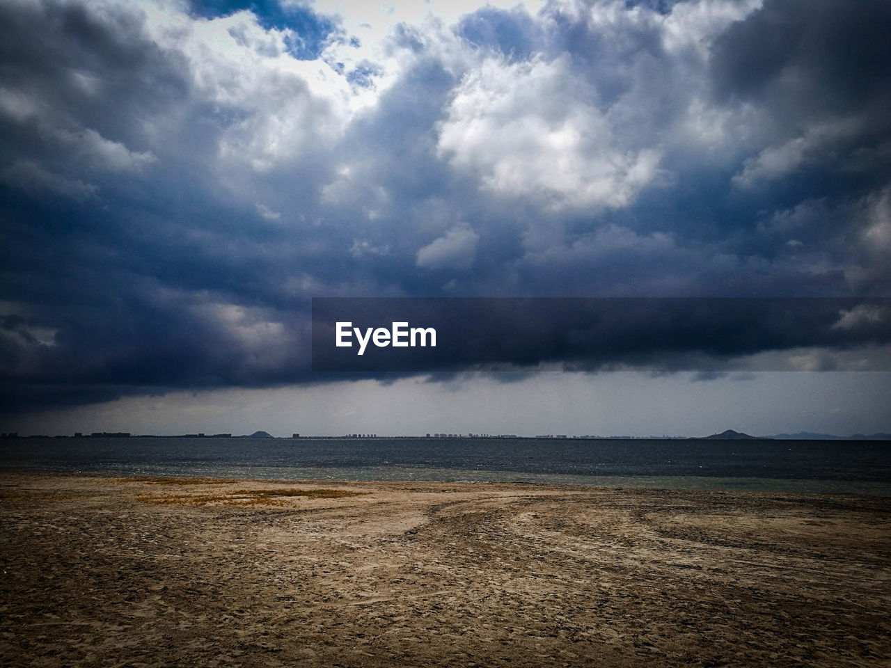 STORM CLOUDS OVER LAND