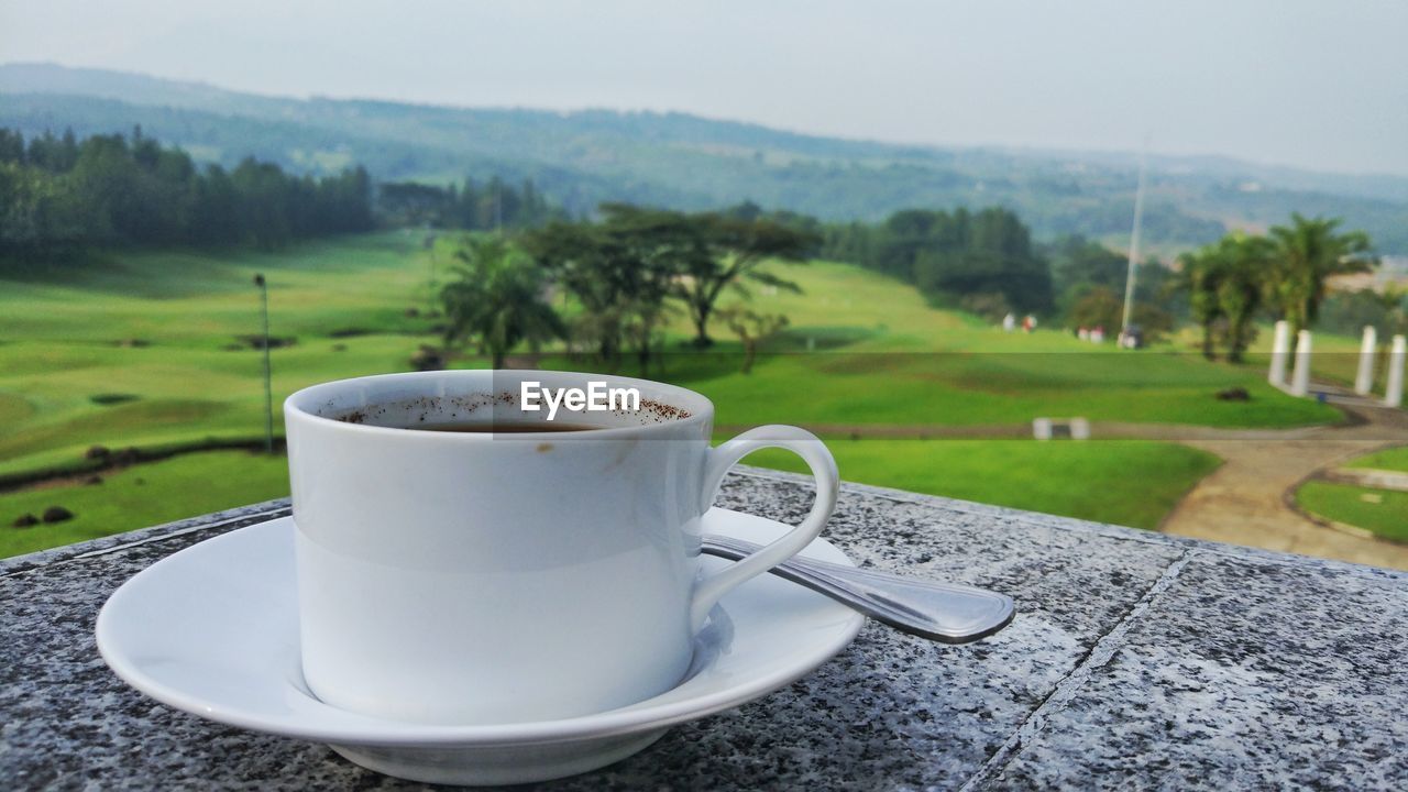 COFFEE CUP ON TABLE