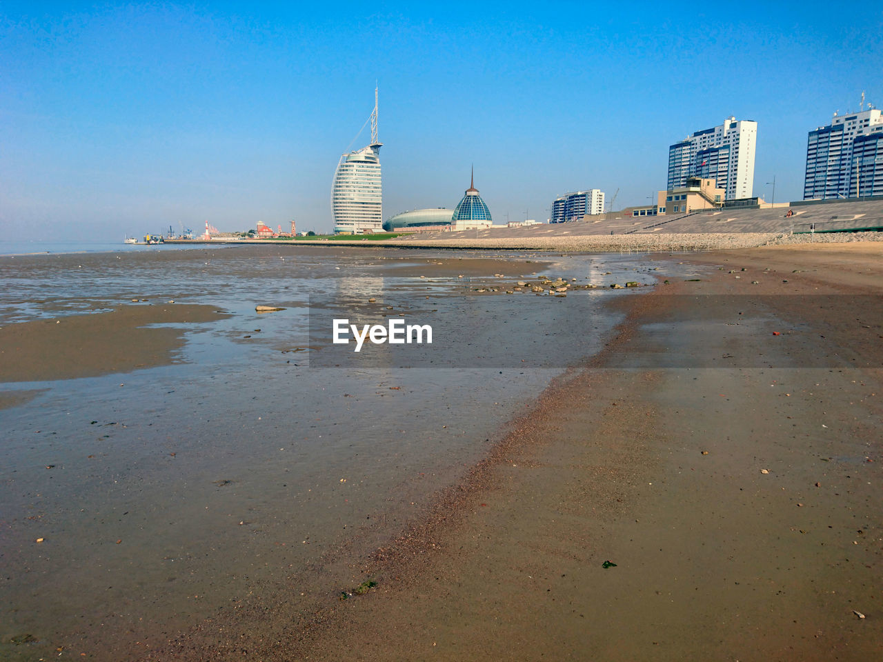 View of beach with city in background