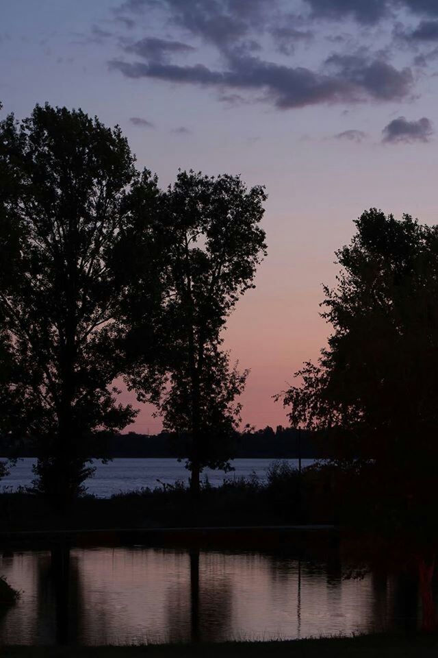 SCENIC VIEW OF RIVER AT SUNSET