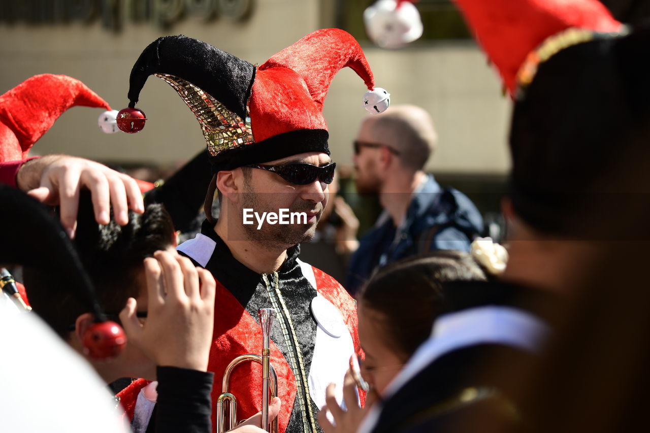 HIGH ANGLE VIEW OF PEOPLE LOOKING AT CAMERA IN TRADITIONAL CLOTHING