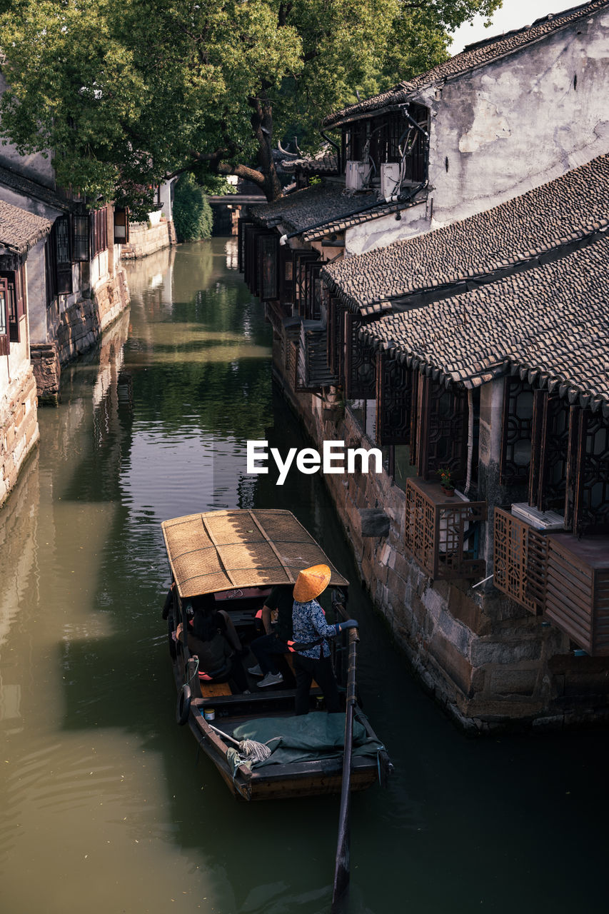 Chinese ancient town with river, boat and history buildings